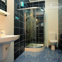 Villa Santorini Номер люкс, душ и санузел.