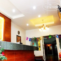 Orchid Inn Стойка регистрации