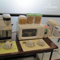 Grande Elegance Serviced Apartment Столовая