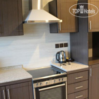 Milestone Hotel Apartment Кухня