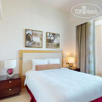 Marriott Executive Apartments Al Jaddaf Спальня с одной кроватью в апа