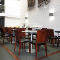 RQ Santiago Suites Зал для завтраков