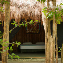 Akumal Natura Glamping king size bed bungalow