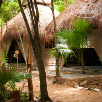 Akumal Natura Glamping king size bed bungalow