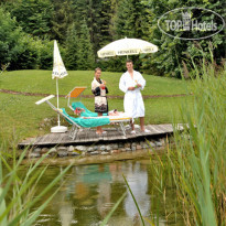 Bergresort Seefeld Терраса у пруда