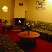 Chalet Tutel Гостиная  с камином.